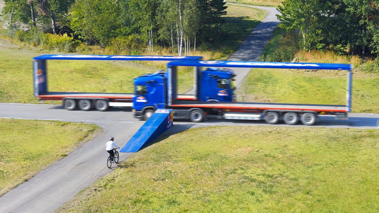 World First! Jumping Through Two MOVING Trucks