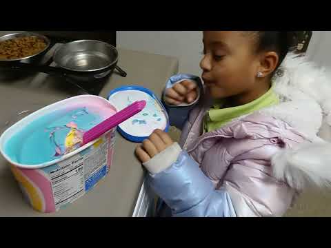 Raji eating 🌈 rainbow ice cream.