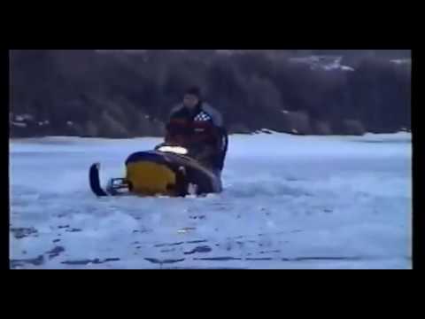 Snowmobile falls through thin ice