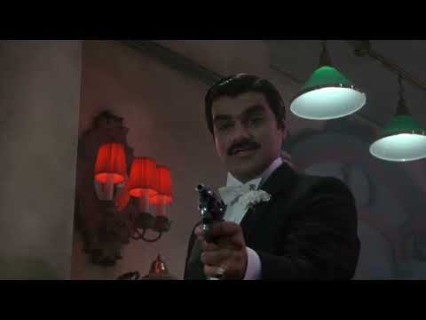 The late Dick Butkus in Johnny Dangerously (1984), robbing Roman Moronie's club