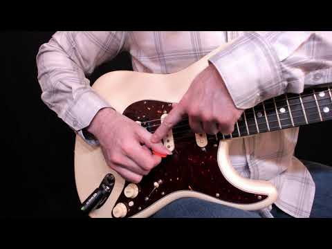 Right (picking) hand position on the electric guitar.