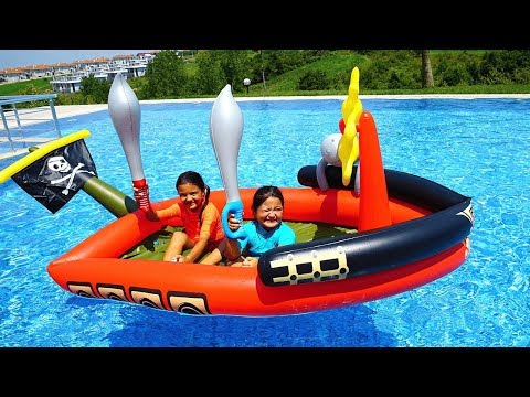 Masal and Öykü play with Giant Inflatable Pirate Ship - Fun Kids Video