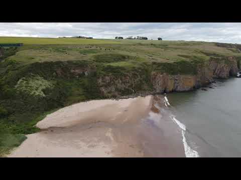 Drone angle of beach and water at Lunan Bay
