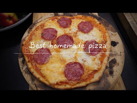 Pizza dough made on the grill extra cheesy. Easy pizza...