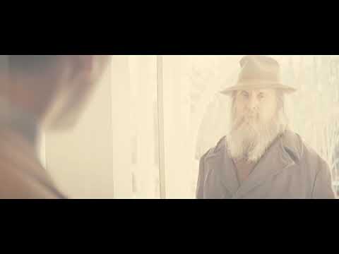 Trailer frame of the outdoor gathering that becomes Felix’s ‘living funeral,’ scored by on-screen bluegrass