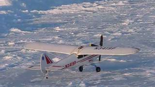 preview picture of video 'RC Piper Super Cub on heavy wind winter mission (HD)'