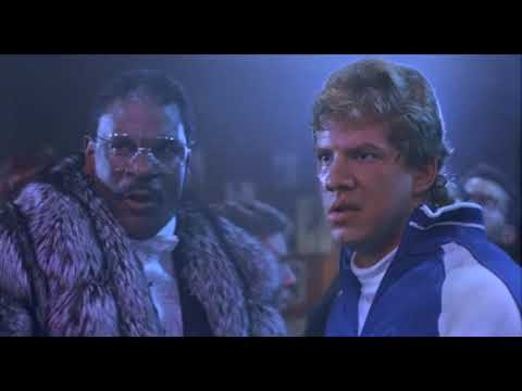 Trailer montage: Rocky coaching Tommy Gunn amid sweat and steam while a rap hook loops