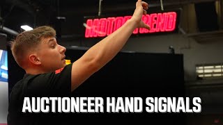 Auctioneer's Guide: Decoding Hand Signals in Auctions