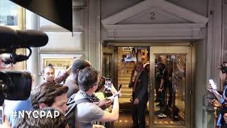 Shakira it's totally surrounded by fans as she leaves St. Regis Hotel in New York City