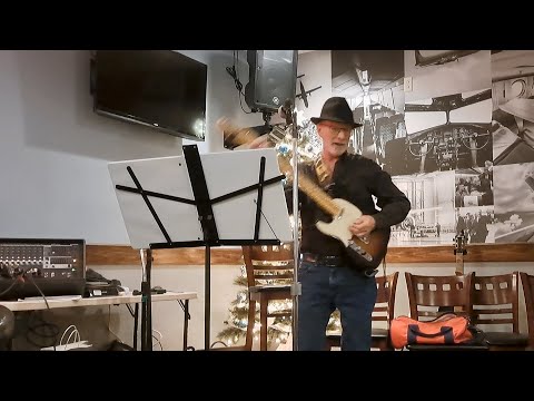 "Secret Agent Man" at open mic night @ Blue Sky Lounge, December 11, 2023