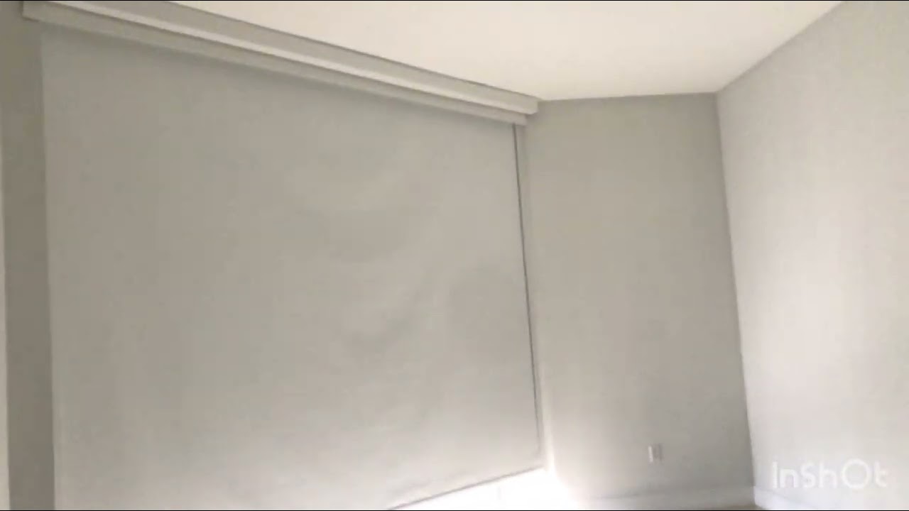 Modern Dual Motorized Roller Shades: Complete Light Control & Ocean Views