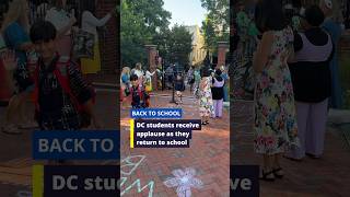 DC students receive applause as they return to school