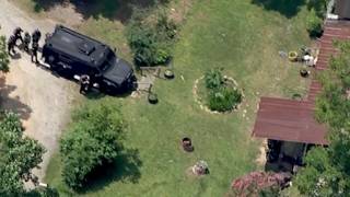 Armed suspect barricaded inside home