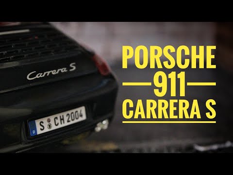 Металлическая машинка Maisto 1:18 «Porsche 911 Carrera S» 31692 / Черный