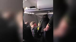 Spirit Airlines flight was diverted after a passenger appeared to try to open an emergency exit door