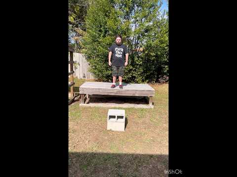 Flying elbow drop onto cinder blocks ( WWE CACTUS JACK STYLE )