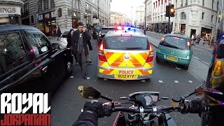 Police and Ambulance through the traffic in London