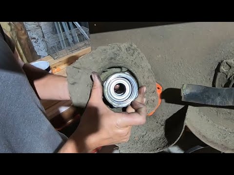 Rebuilding a mower spindle and installing a grease fitting