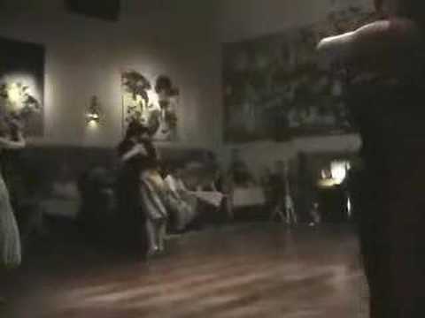 Jennifer Bratt  and  Ney Melo  are  dancing  to  the  tango  "  Organito De La Tarde  "