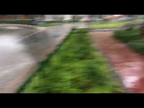 Cars splash through water at Upper Cross Street