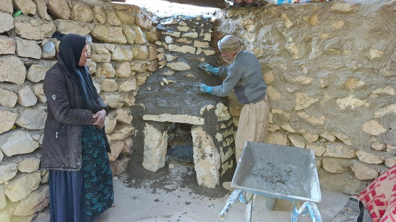 Iran nomadic life: building a cozy fireplace with natural stones in the heart of the mountains