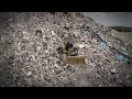 Steep Landfill Hill No Match for Cat D6 XE Waste Handler Dozer