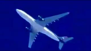 Airplane flying far away against a clear blue sky