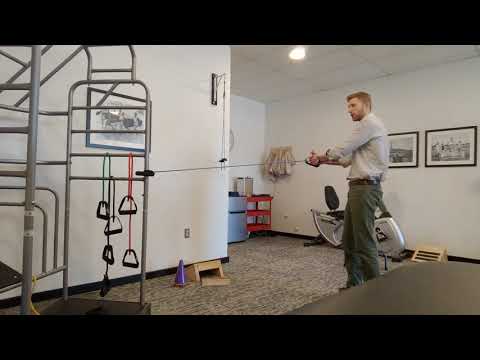 Trunk rotations with theraband