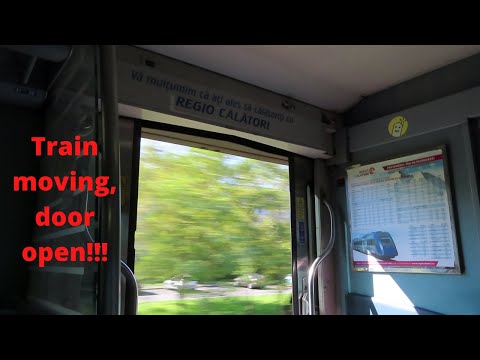 Romania: Open door on a moving Regio Calatori train from Brasov to Bucuresti Nord