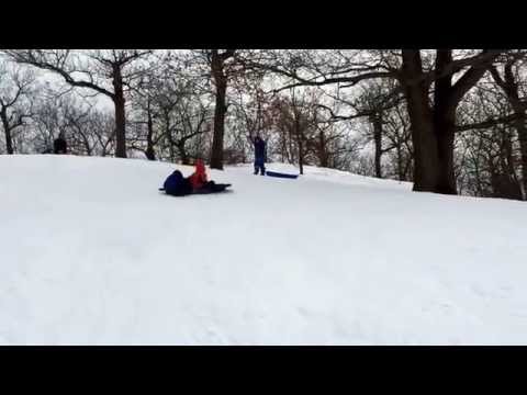 Sledding on a steep hill in Medford, MA