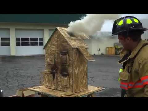 Salem firefighter demonstrates fire flow paths by burning down doll house