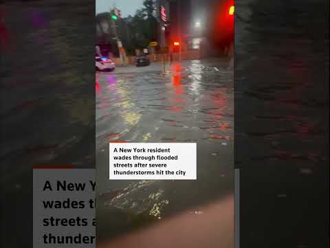 Video Thumbnail: New Yorker wades through flooded streets after thunderstorms