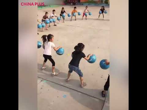 Kindergarten kids master basketball bouncing game