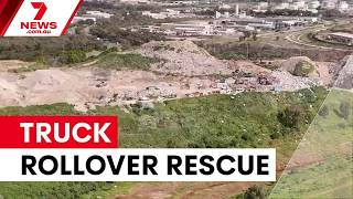 Truck rollover traps driver at Kwinana tip | 7NEWS