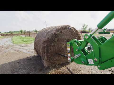 Part of a video titled How To spear A Large Round Bale | John Deere Tips Notebook - YouTube