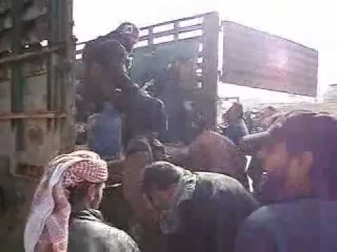 كتيبة أنوار الحق تقوم بتوزيع غاز البوتان على المواطنين في ناحية سلوك في محافظة الرقة