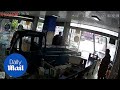 Moment dog causes tuk tuk to crash through a shop window - Daily Mail