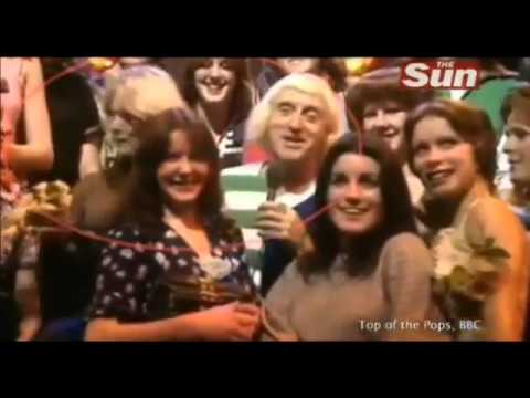 Jimmy Savile molests girl live on Top Of The Pops 1976
