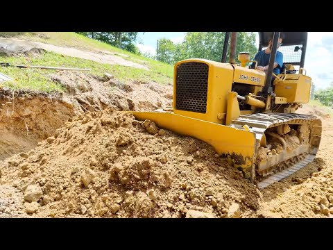 Pushing Dirt with a classic JD 450B Dozer. HARD clay and RAW dozer sounds.