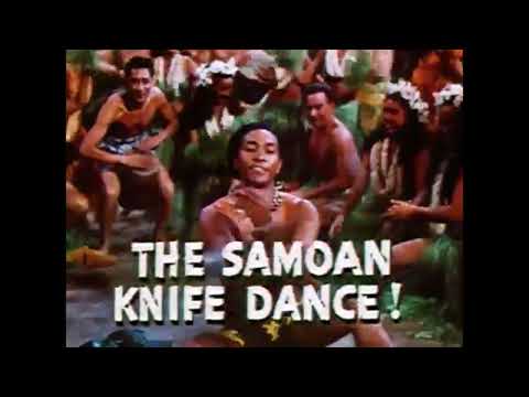 Trailer image: lagoon and village set dressing where numbers like Singing in the Sun play