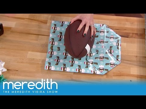 Part of a video titled How To Wrap Oddly Shaped Gifts! | The Meredith Vieira Show - YouTube