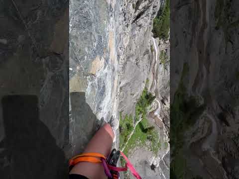 Climber Skillfully Navigating Swiss Via Ferrata Route