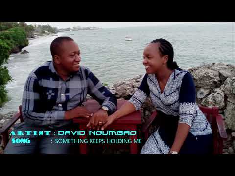 SOMETHING KEEPS HOLDING ME   by  David Uvumilivu Ngumbao