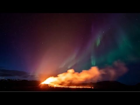 WATCH: Northern Lights shine over an erupting volcano in Iceland