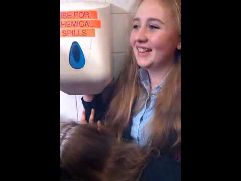 Ella getting hand stuck in towel dispenser Video