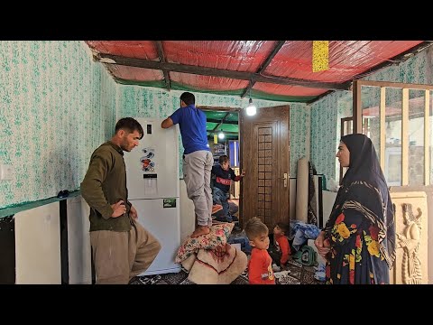 Rural family.  Freezer refrigerator repair in the village by the factory expert