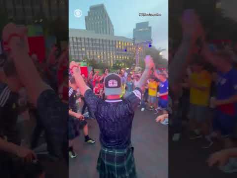 Soccer fans, local and international, hype up police officer overseeing Fan Fest in Boston #shorts