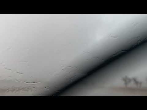 INSIDE large tornado rain wrapped with debris north of Clarendon TX