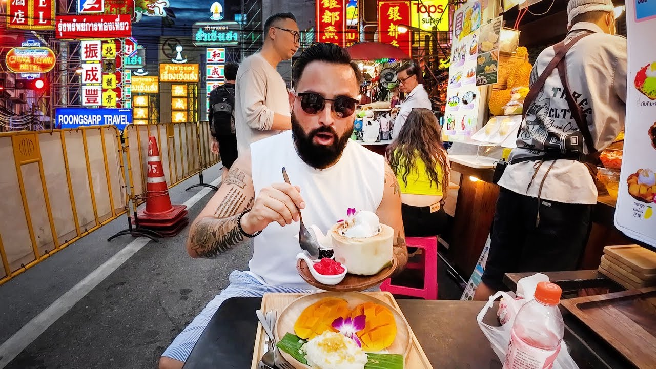 A traveler savors the exotic street food in Bangkok's vibrant Chinatown.