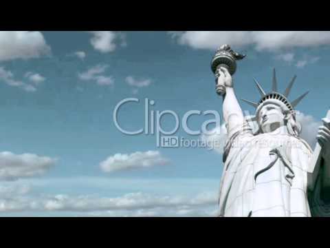 A time-lapse and seen-from-below shot of the Statue of Liberty in New York.
